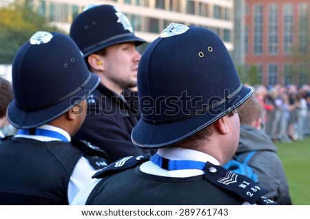 LONDON - MAY 12 2015:Metropolitan Police Service officers on guard duty.Since Jan 2015 Police across Britain have been put on high alert and warned that they may be targeted in terror attacks