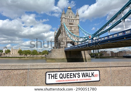 The Tower Bridge spanning over River Thames with the Tower of London in the background as view from   the Queen\'s Walk South Bank in London, UK.