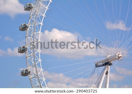 LONDON - MAY 12 2015:Visitors in a ovoidal capsule of London Eye in London, UK.The London Eye can carry 800 people each rotation, which is comparable to 11 London red double decker buses