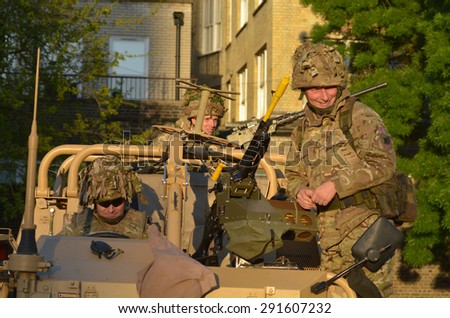 LONDON - MAY 14 2015:British Army soldiers.According to Ministry of Defence, it costs Â£30,000 to train a soldier.Selection costs Â£7,000, while Basic Training and Combat Infantry Course cost Ã?Â£23,000