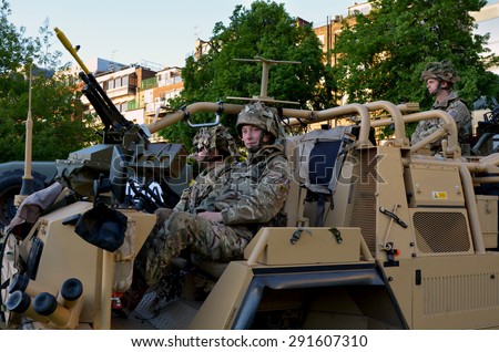 LONDON - MAY 14 2015:British Army soldiers.According to Ministry of Defence, it costs Â£30,000 to train a soldier.Selection costs Â£7,000, while Basic Training and Combat Infantry Course cost Â£23,000