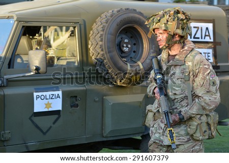 LONDON - MAY 14 2015:British Army soldier.According to Ministry of Defence, it costs Ã?Â£30,000 to train a soldier.Selection costs Â£7,000, while Basic Training and Combat Infantry Course cost Â£23,000.