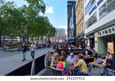 LONDON - MAY 13 2015:Visitors in Leicester Square London UK.The square is the prime location in London for world leading film premiÃ?Â�res and co-hosts the London Film Festival each year.