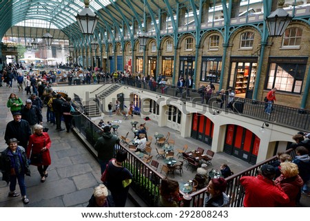 LONDON - MAY 15 2015:Visitors in Covent Garden markets. It\'s one of the most popular shopping center and tourist site in London, UK.