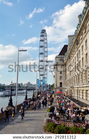 LONDON, UK - MAY 15 2015: London Eye and London County Hall in London UK.County Hall is the site of businesses and attractions, including the London Sea Life Aquarium and London Eye visitor centre