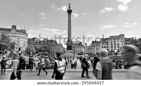 LONDON, UK - MAY 14 2015:Visitors in Trafalgar Square London, England United Kingdom. Trafalgar Square is the fourth tourist attraction on Earth