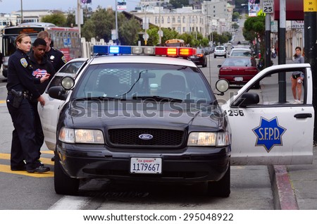 SAN FRANCISCO - MAY 15 2015:SFPD officers arresting black american man in San Francisco.Overall, Black Americans are arrested at 2.6 times the per-capita rate of all other Americans.