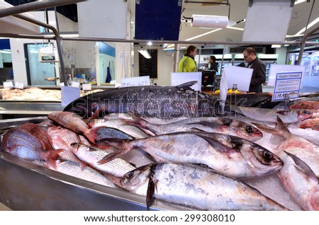 AUCKLAND - JULY 08 2015:Shoppers in Auckland Fish Market, Auckland New Zealand.The Fish Market building, hosts fresh seafood retailers, a boutique food market, restaurants and Auckland Seafood School.