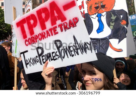 AUCKLAND - AUG 15 2015:Thousands march against TPP trade agreement in Auckland.12 nations including New Zealand have been negotiating the TTP trade deal, which would cover 40% of the world economy.