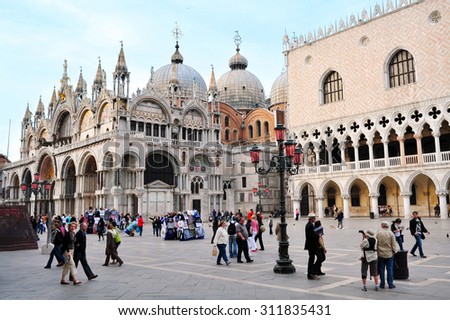VENICE, ITALY - APRIL 30 2011:The Patriarchal Cathedral Basilica of Saint Mark at the Piazza San Marco - St Mark\'s Square , Venice Italy.About 30 million people visit the city each year.