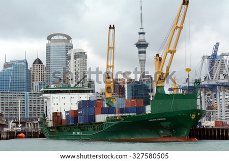 AUCKLAND,  NZL - OCT 13 2015:Big cargo ship unloading containers in Ports of Auckland New Zealand.ItÃ¢??s New Zealand\'s busiest port and the third largest container terminal in Australasia.