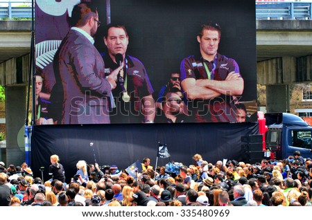 AUCKLAND - NOV 04 2015:All Blacks coach Steve Hansen and Richie McCaw speek to the crowd in Victoria Park Auckland, New Zealand.The All Blacks are the holders of the Rugby World Cup in 2011 and 2015.