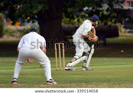 AUCKLAND - NOV 14 2015:Cricket batsman try to blocks the ball. Cricket is played by 120 million players in many countries, making it the world\'s 2nd most popular sport.