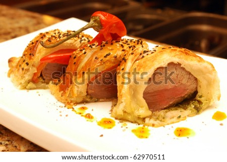 A meat dish with pastry at a restaurant