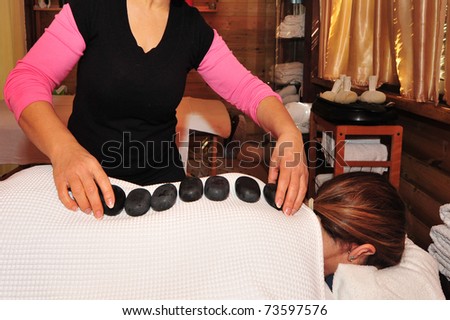 Special volcanic stone massage session at a spa center