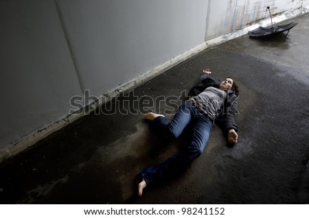 Crime scene concept photo of a murder victim woman lying dead on the