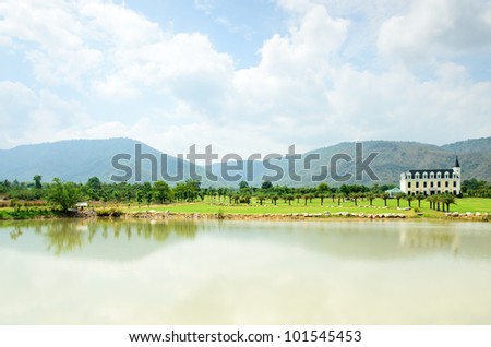 Alone old boutique style house in silent hill and beautiful nature with blue sky and reflection of hill in river, Chateau de khaoyai, north east of Thailand
