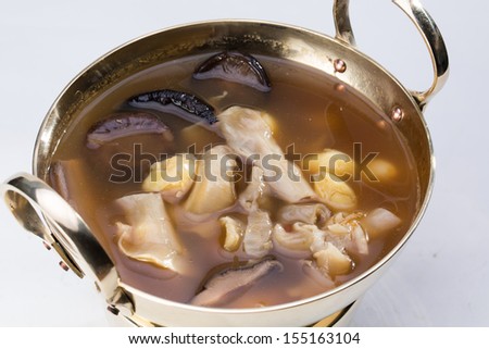 Chicken and Gingko soup in bronze bowl