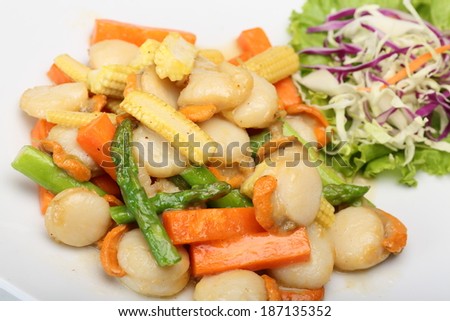 Fried scallop with various vegetable on white dish