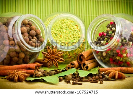 Pack of several spices and herbs in glass jars