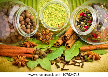 Pack of several spices and herbs in glass jars