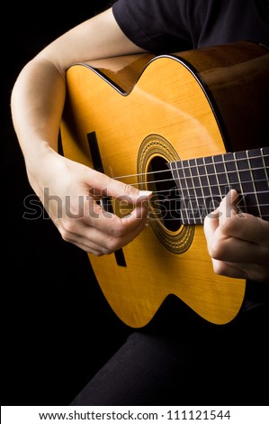 Closeup view of playing classic spanish guitar