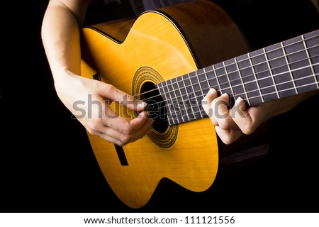 Closeup view of playing classic spanish guitar