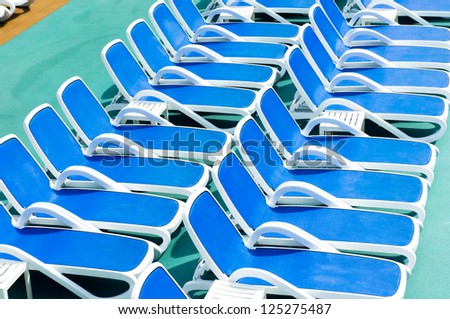 Close up view of blue deck chairs