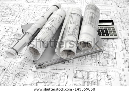 Grey folder document, calculator and project drawings