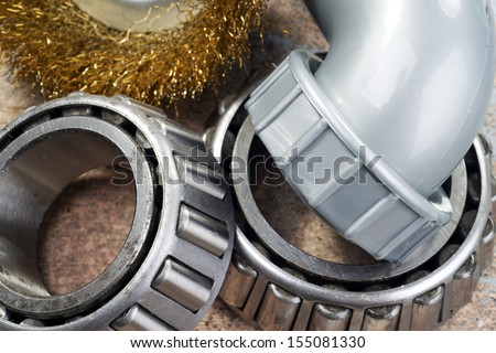 roller bearings, wire brush and plastic tube