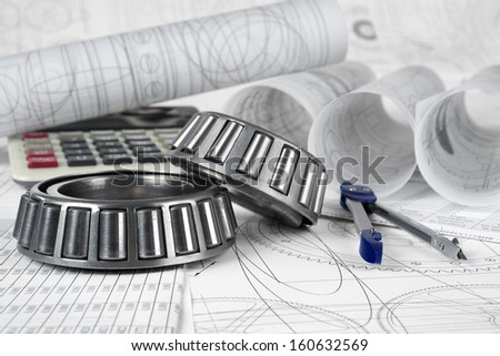 roller bearings, compasses, calculator  and drawings