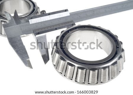 roller bearings and gauge  isolated on white background