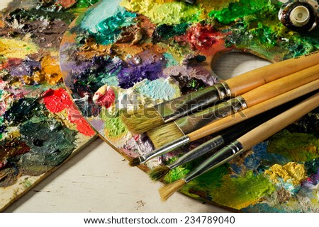 palette with paintbrushes