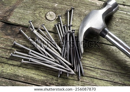 hammer and nails  on wooden background