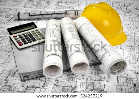 Yellow helmet, calculator, grey folder document and project drawings