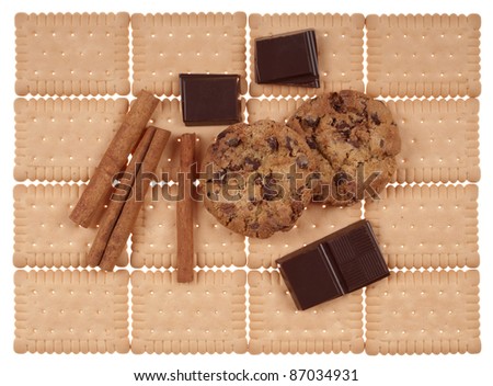 Panel of several tasty  cookies, chocolate,  and sticks cinnamon