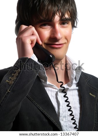 A portrait about a handsome customer service representative guy who is smiling and he is calling on the phone. He is wearing a white shirt and a stylish black suit.