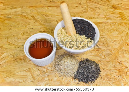 arranged sesame oil and brayed sesame and uncooked in a bowl