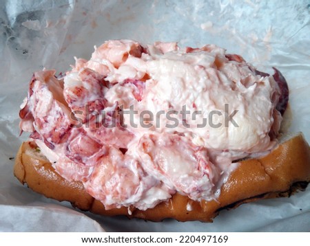 Very large and generous lobster roll on toasted bun in paper, from Winthrop Massachusetts