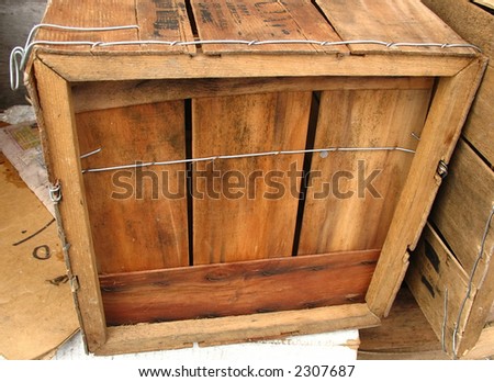Small wooden shipping crate or box with twine around it.