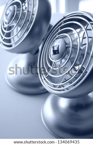Abstract of two small air fans in monochrome