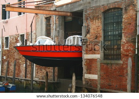 Ambulance in Venice, Italy stored away on a building