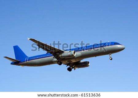 Blue sky with big passenger airplane landing in airport of Palma de Mallorca