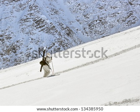 A skier ascending for free ride