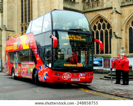 BATH, SOMERSET, UK. CIRCA- 16TH FEBRUARY 2010. Sightseeing bus ready to take passengers from outside the Abbey.