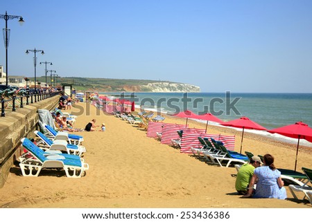 SANDOWN, ISLE OF WIGHT, UK JULY 08, 2013. . Sunbeds and parasols in July on Sandown beach, Isle of Wight, England, UK.