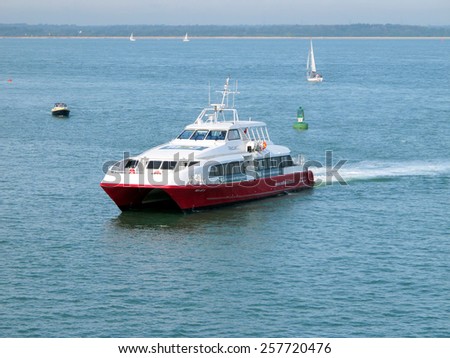 COWES, ISLE OF WIGHT, UK. OCTOBER 07, 2012.  The red funnel catamaran passenger ferry in the Solent off Cowes, Isle of Wight, UK.