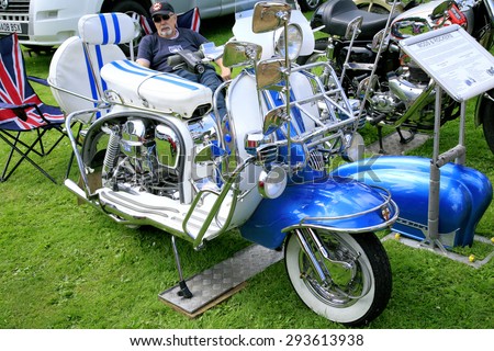 ELVASTON, DERBYSHIRE, UK. JULY 04, 2015.  A vintage 1960  Lambretta 150 scooter used in the Mods and Rockers era on display at the country steam rally at Elvaston, Derbyshire, UK.