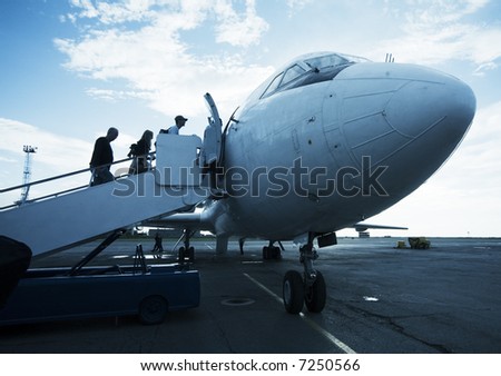 airplane on the airfield with a ladder