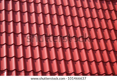 The roof of red tiles laid out